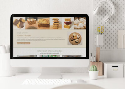 Doreens Home Bakery About the Bakery Website Design Modern Office Computer Mockup smaller ()