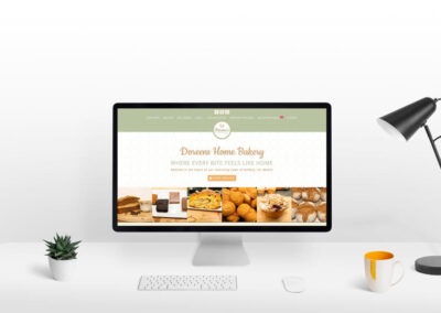 Doreens Home Bakery Website Showcase Desktop PC Screen on modern white office desk smaller ()