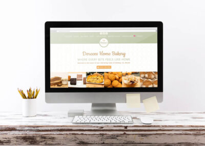 Doreens Home Bakery Website Showcase Desktop PC Screen on wooden office desk smaller ()
