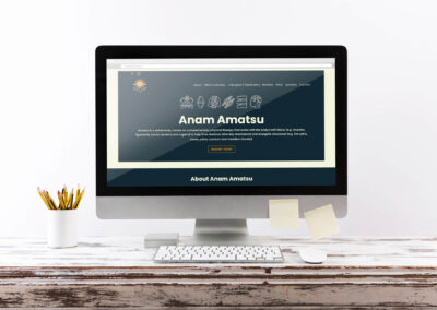 Anamamatsu Website Design on desktop iMac on a wooden desk postits and pencils