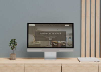 Mangan Woodcraft Website showcase on PC on Modern office desk