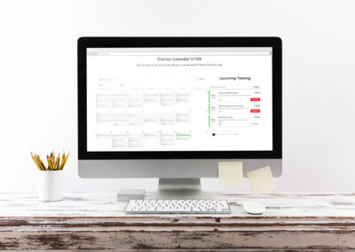 GTSS Booking System Computer Mockup Wooden Desk ()